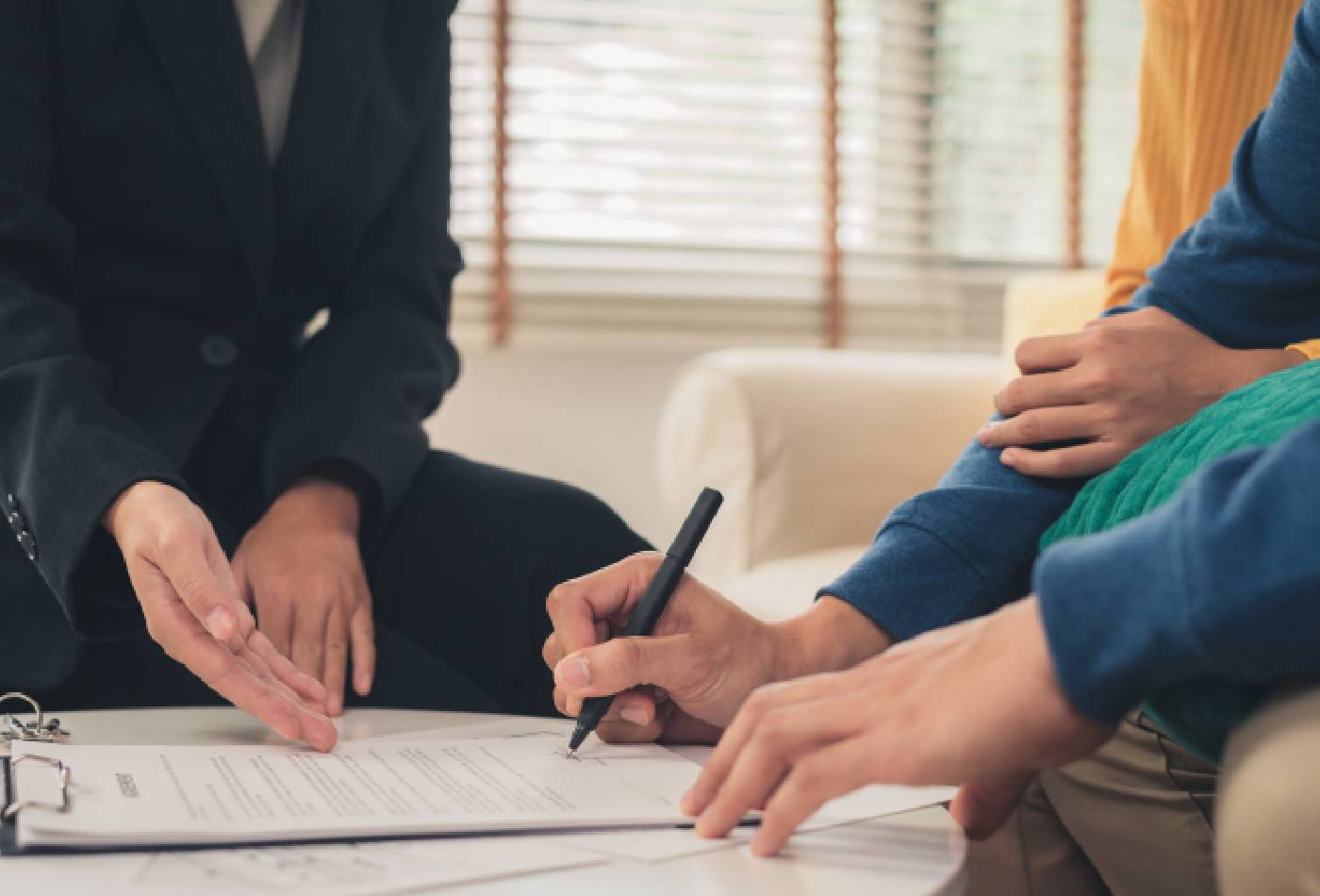 A Claim Support Zone advisor reviewing insurance options with a young family